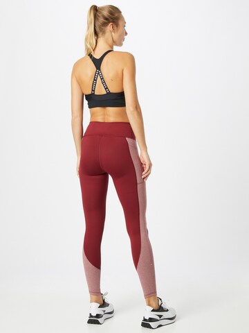 Skinny Pantaloni sportivi di UNDER ARMOUR in rosso