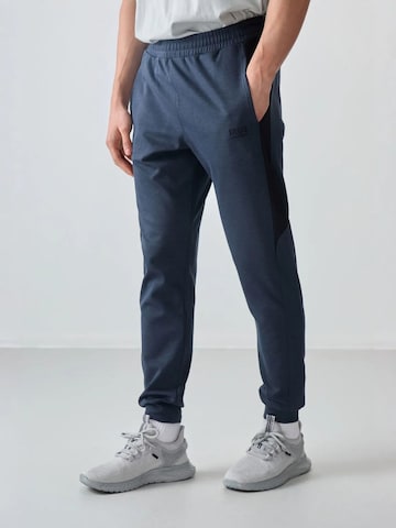 Pantaloni di Tommy Life in blu: frontale