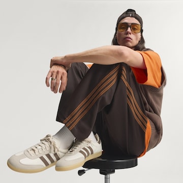 ruda ADIDAS ORIGINALS Standartinis Kelnės 'Firebird'
