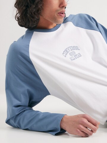 CONVERSE Bluser & t-shirts i blå