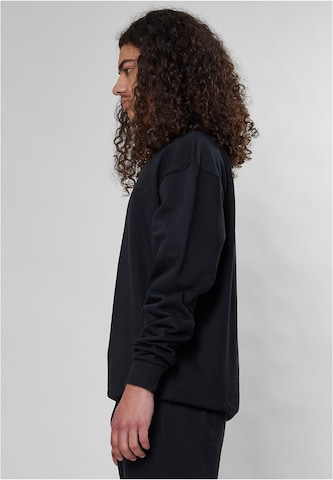 9N1M SENSESweater majica 'Essential' - crna boja
