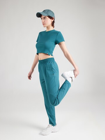 UNDER ARMOUR Koszulka funkcyjna 'Rival' w kolorze zielony