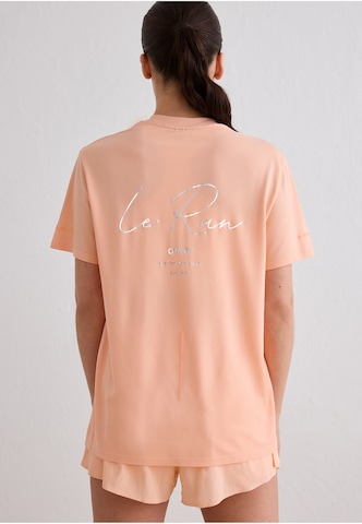 Aim'n Performance Shirt 'Le Run' in Orange: front