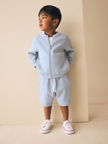 Next Set in Blauw: voorkant