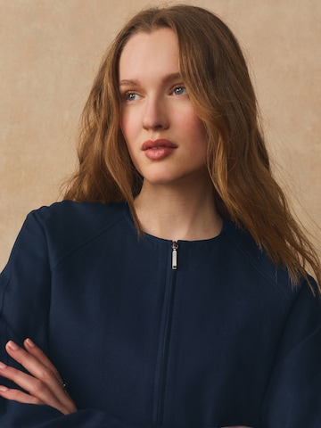 Next Tussenjas in Blauw