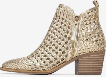 Xti - Botines en oro: frente