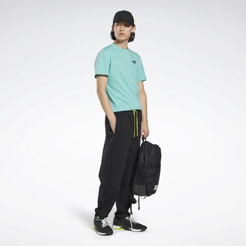 Reebok Tapered Workout Pants 'Les Mills®' in Black