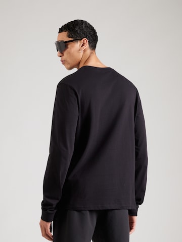 ReebokTehnička sportska majica - crna boja