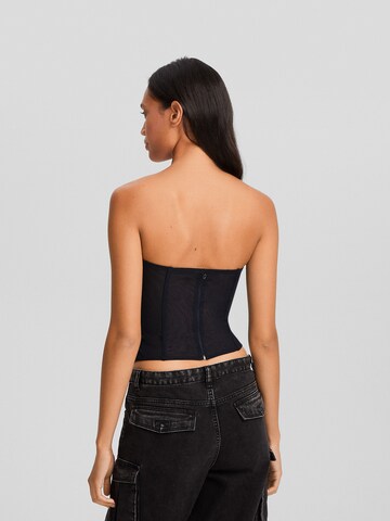 Corsete de la Bershka pe negru