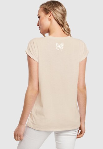 T-shirt 'Flowers Bloom' Merchcode en beige
