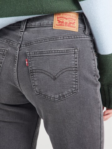 LEVI'S ® Flared Jeans 'SUPERLOW' in Grau