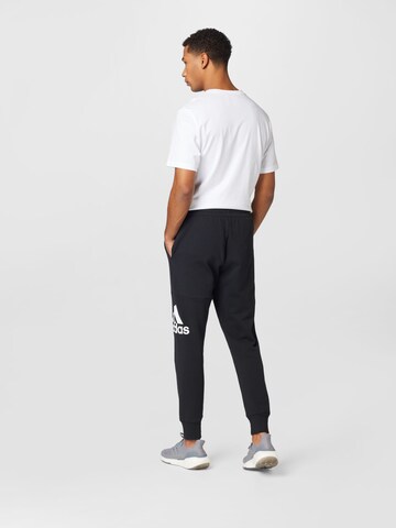 ADIDAS SPORTSWEAR Конический (Tapered) Спортивные штаны 'Essentials' в Черный