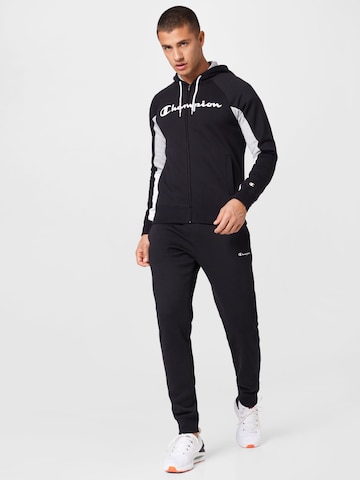 Champion Authentic Athletic Apparel Tracksuit in Black: front