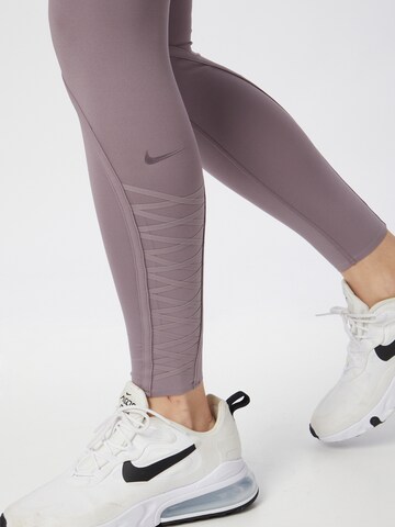 NIKE Skinny Sportnadrágok 'ONE LUXE' - lila