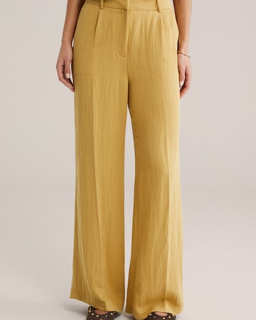 Loosefit Pantalon à plis WE Fashion en jaune : devant