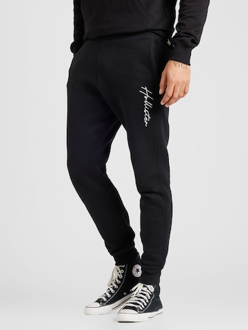 HOLLISTER Tapered Pants in Black: front