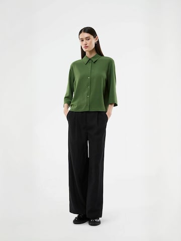 Maglietta ' Popelmd ' di modström in verde