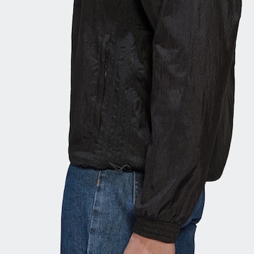 ADIDAS ORIGINALS Between-season jacket 'Reveal Material Mix' in Black