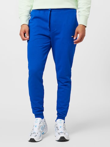 TOMMY HILFIGER Tapered Trousers in Blue: front