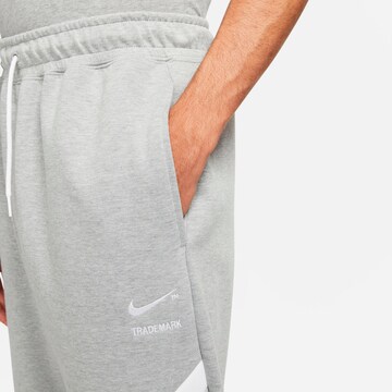 Nike Sportswear Tapered Pants 'Swoosh Tech' in Grey