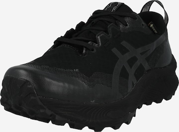 ASICS - Zapatos bajos 'Trabuco 12' en negro: frente