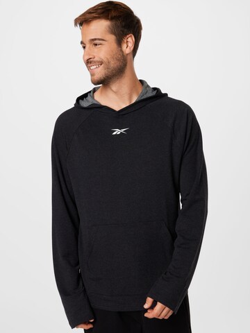 Sweat de sport Reebok en noir : devant