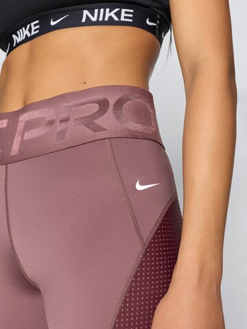 NIKE - Skinny Calças de desporto em roxo