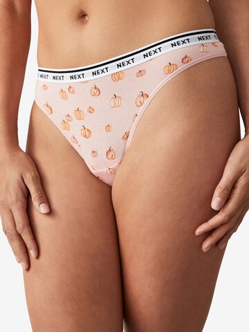 Next String i orange: framsida