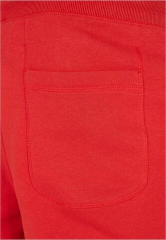 Tapered Pantaloni di Urban Classics in rosso