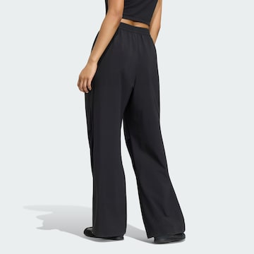 ADIDAS SPORTSWEAR - Pierna ancha Pantalón deportivo en negro