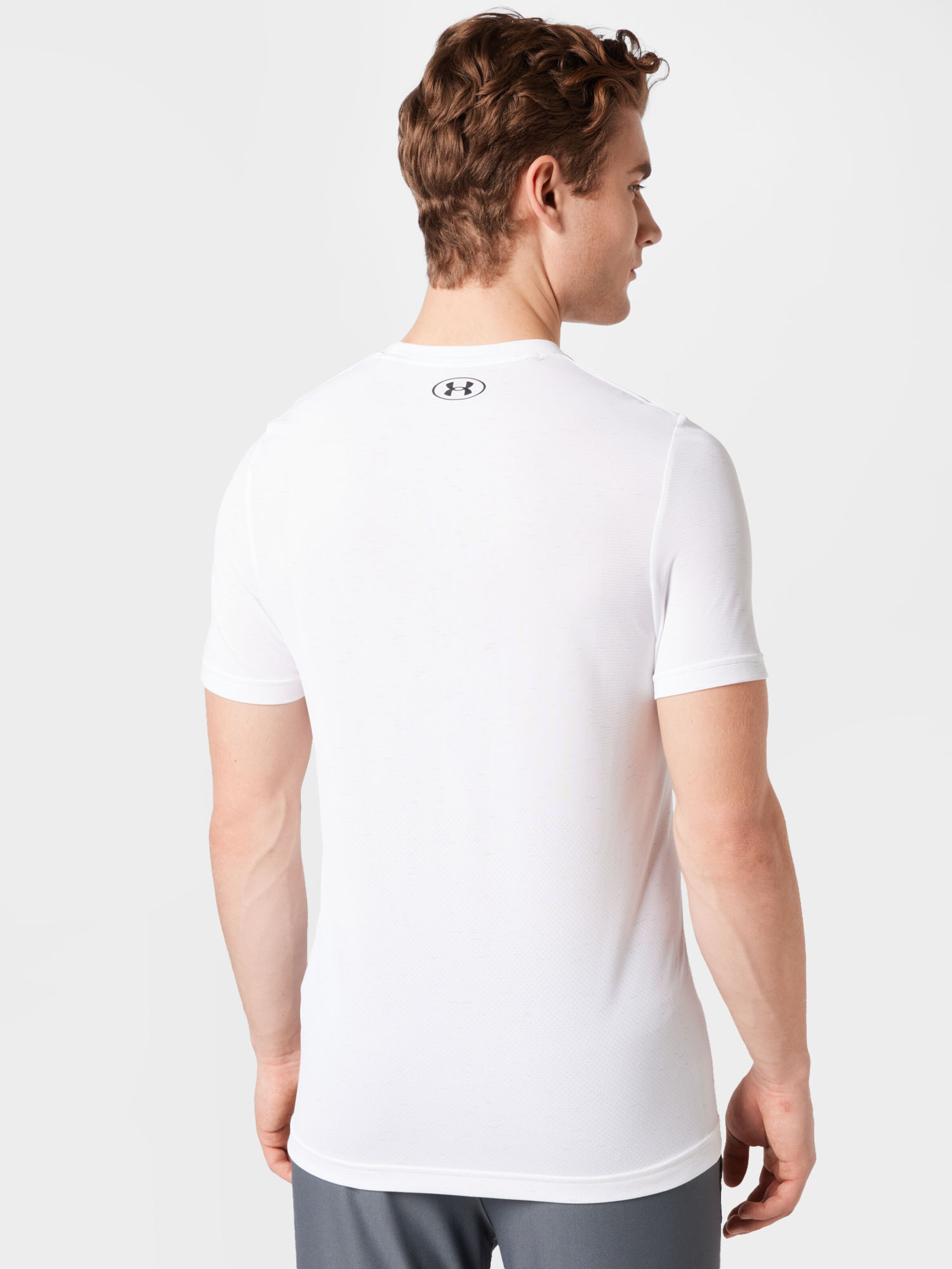 Sport T-Shirt fonctionnel UNDER ARMOUR en Blanc 