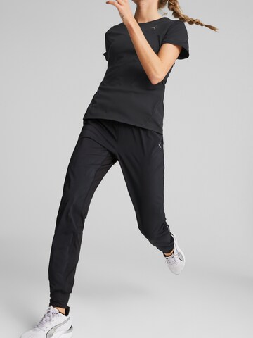 PUMA Tapered Workout Pants in Black: front