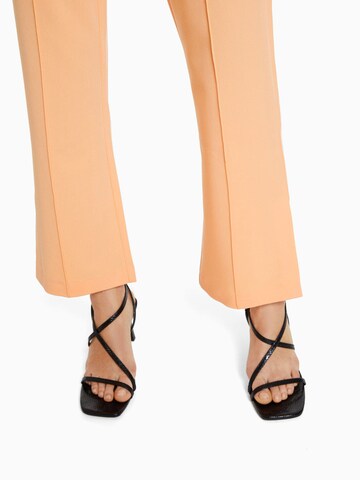 Bershka Flared Pants in Orange