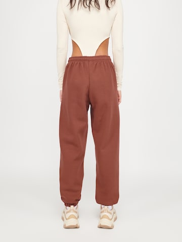 ABOUT YOU x VIAM Studio Regular Pants 'Motivation' in Brown: back