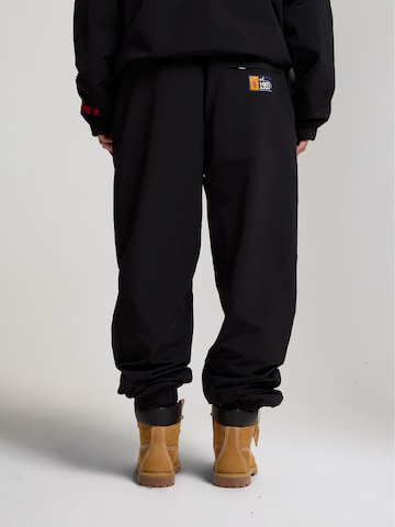 Effilé Pantalon AND1 en noir