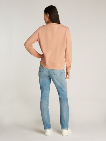 Felpa di Calvin Klein Jeans in arancione