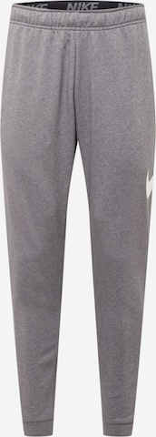Effilé Pantalon de sport NIKE en gris : devant