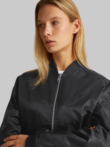 Calvin Klein Jeans Átmeneti dzseki 'HERO' - fekete