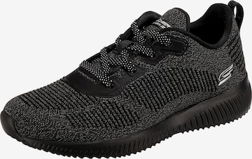 Baskets basses SKECHERS en noir : devant