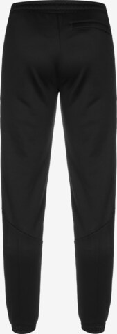Effilé Pantalon de sport 'King' PUMA en noir