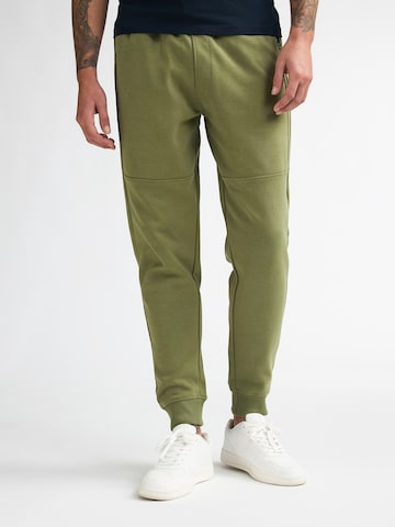 Petrol Industries Конический (Tapered) Штаны в Зеленый: спереди