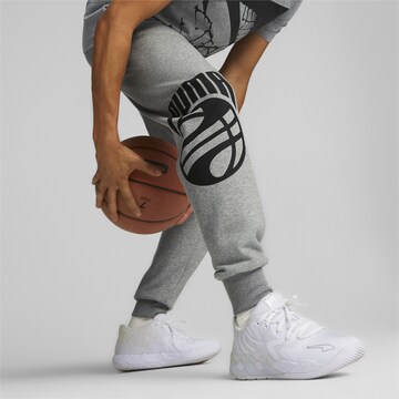 Effilé Pantalon de sport PUMA en gris