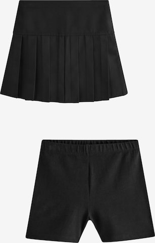 Next Rock mit Shorts in Schwarz: Vorderseite