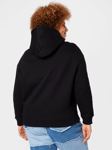 Tommy Jeans Curve Collegepaita värissä musta