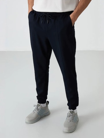 Pantalon de sport Tommy Life en noir : devant