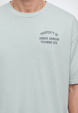 UNDER ARMOUR - Camiseta funcional 'PROPERTY OF UA' en gris