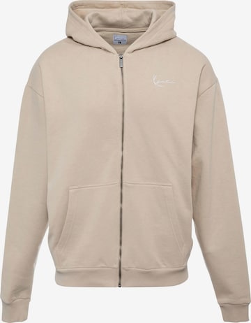 Veste de survêtement Karl Kani en beige : devant