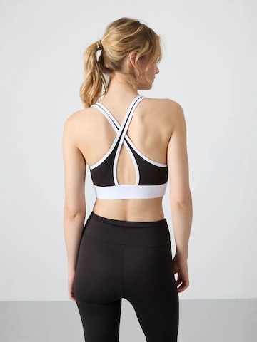 Top sportivo di Tommy Life in nero