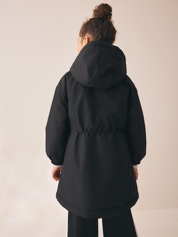Next Mantel in Schwarz