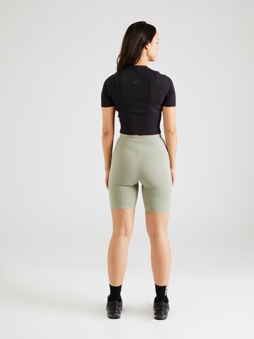 UNDER ARMOUR Skinny Fit Спортен панталон 'Motion' в зелено